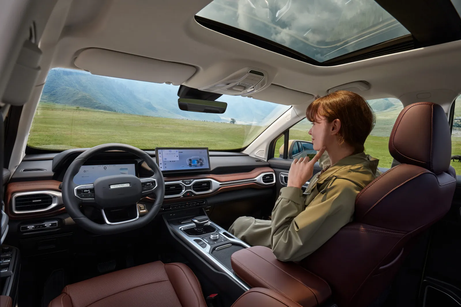 Cabin interior with panoramic sunroof, passenger seated