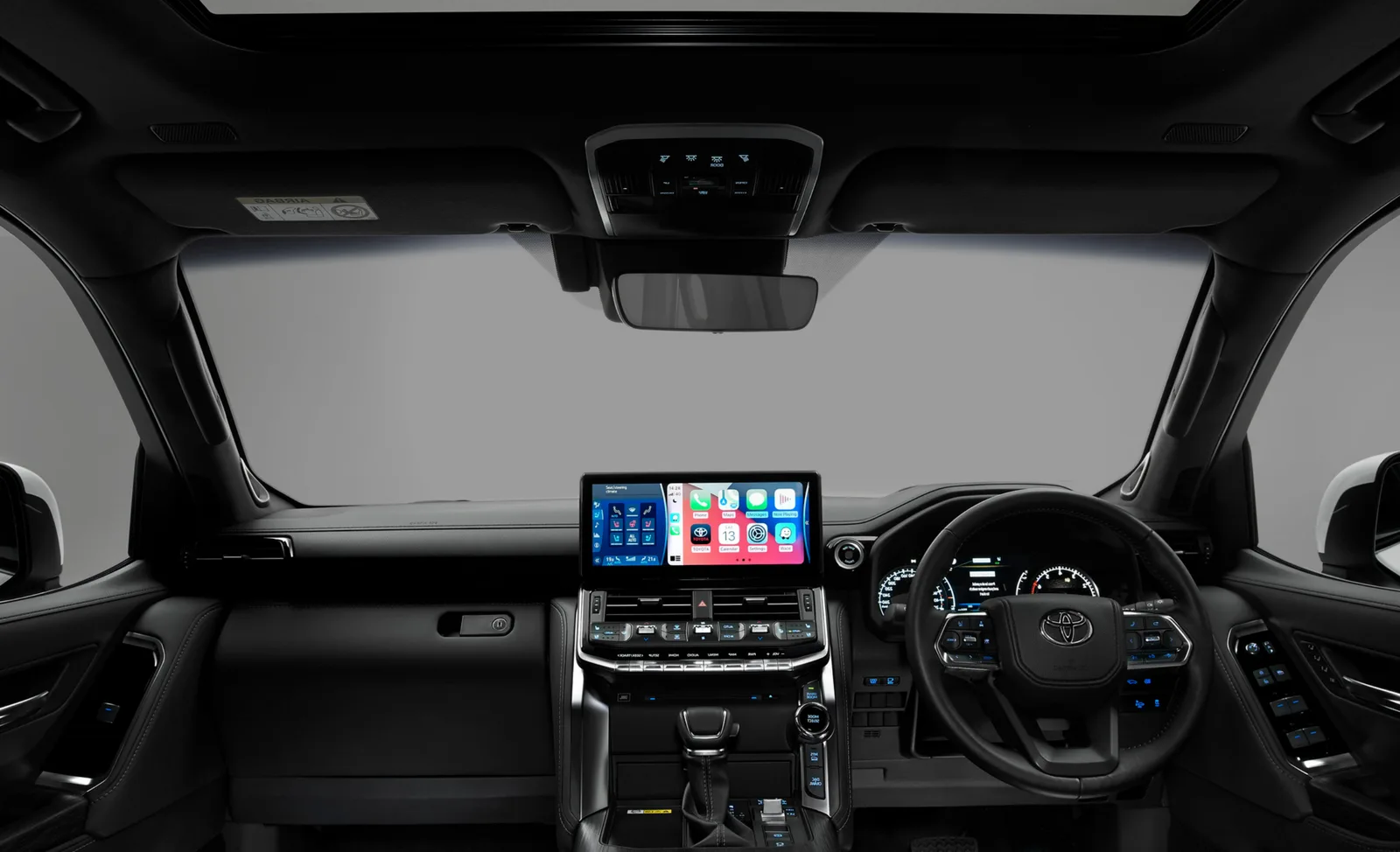 Cockpit view — touchscreen infotainment and digital instrument cluster