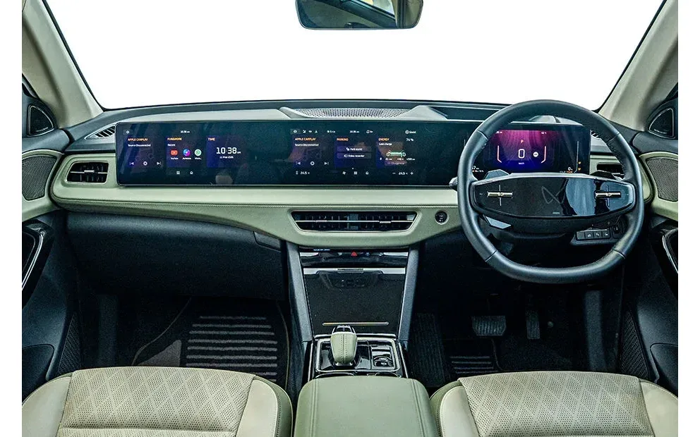 Dashboard with dual screens and steering wheel